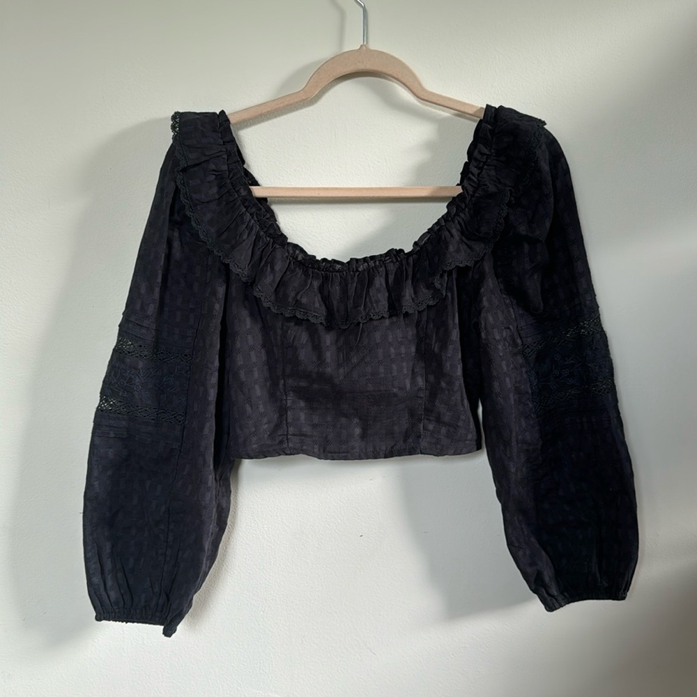 Long sleeve cropped blouse with bow back.